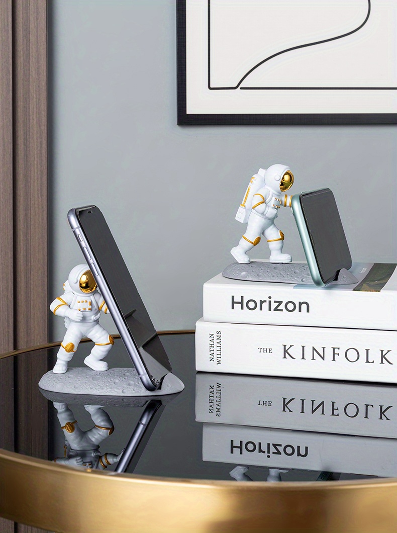 spice up your desk with this astronaut themed phone holder perfect for office decor details 5