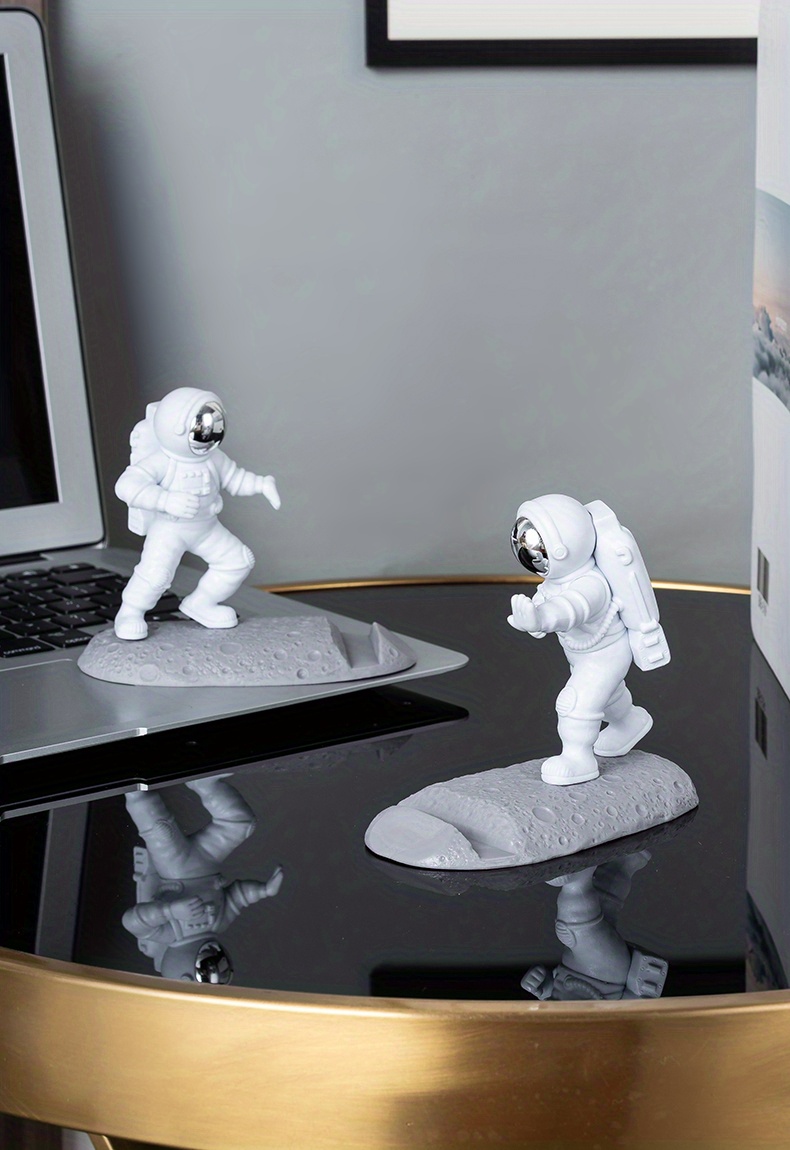 spice up your desk with this astronaut themed phone holder perfect for office decor details 14