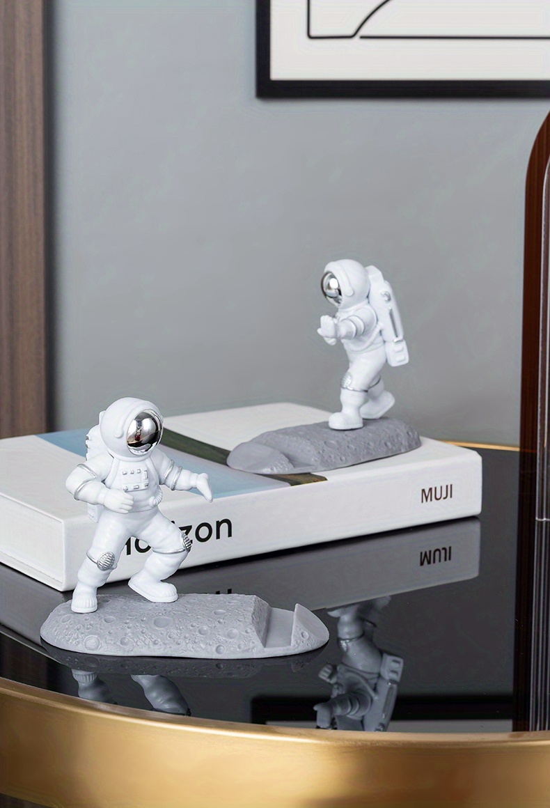 spice up your desk with this astronaut themed phone holder perfect for office decor details 17