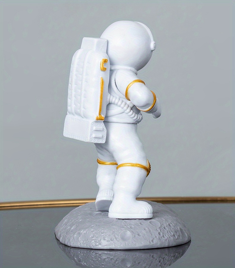 spice up your desk with this astronaut themed phone holder perfect for office decor details 24