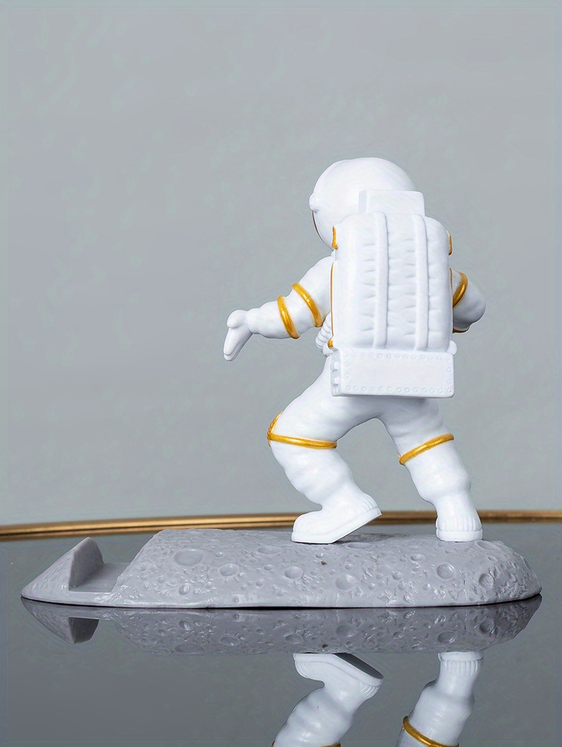 spice up your desk with this astronaut themed phone holder perfect for office decor details 26