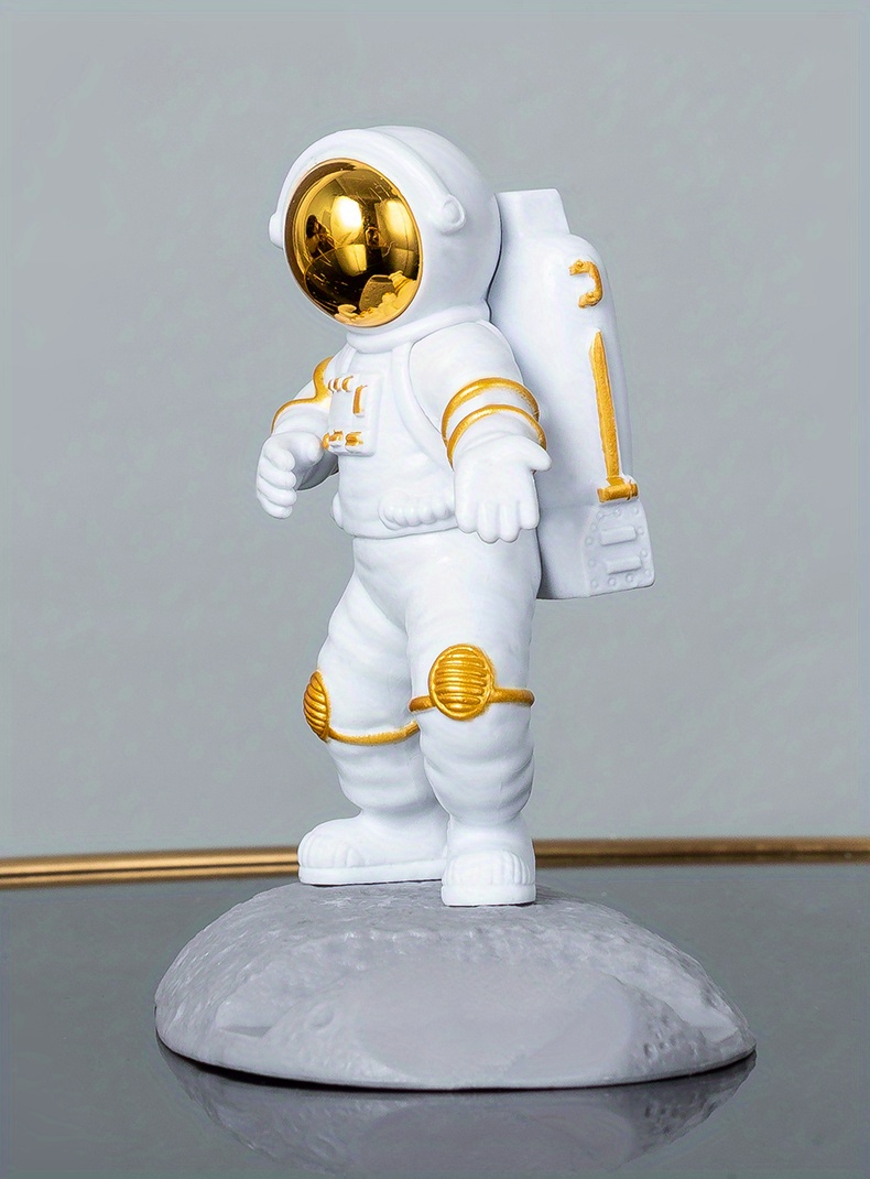 spice up your desk with this astronaut themed phone holder perfect for office decor details 28